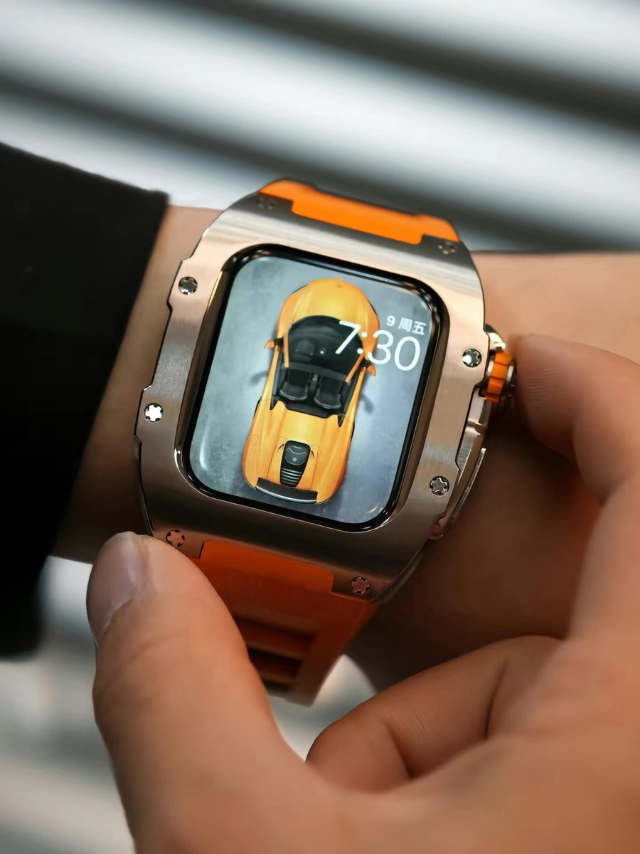 A man wearing an Apple Watch and pressing the watch crown which applied Kewusuma Titan Series - Silver Titan titanium Apple Watch Case with a sunset orange watch strap